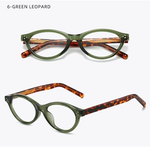 Macro detail of retro oval green frame glasses with classic leopard print temple arms