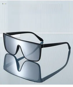 Macro detail of silver mirror lens and glossy black frame on stylish sports sunglasses