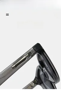 Détail de la branche de lunettes avec ornement métallique et matériau texturé