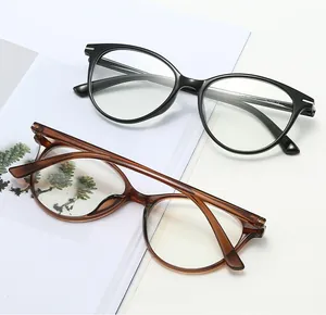 Detailed macro view of TR90 glasses frames in black and tortoise showing metal hinge accents