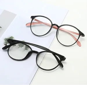 Close-up of stylish round eyeglass frames showing size specs on temple and CE mark