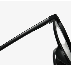 Macro shot of durable hinges and glossy black temple joints on round eyeglasses
