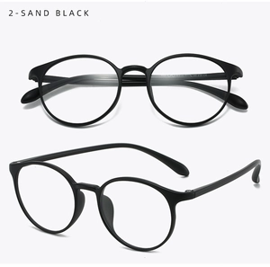 Detail of matte sand black round eyeglass frames showing front and side profile