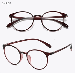 Detail view of wine red translucent round frames and smooth temple tips in classic style
