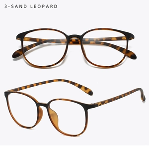 Detail of retro oversized eyewear frame with matte black top and sand leopard print arms