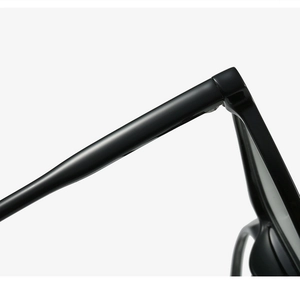 Detail of the high-quality hinge and polished black temple on these square glasses