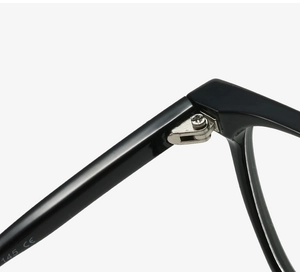 Macro detail of silver metal hinge and screws on black square glasses frame