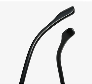 Detail of glossy black TR material eyeglass temples with ergonomic curved design