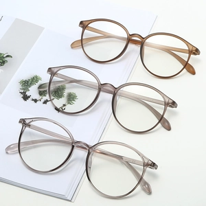 Retro round glasses frames in translucent tea, gray, and clear colors for women