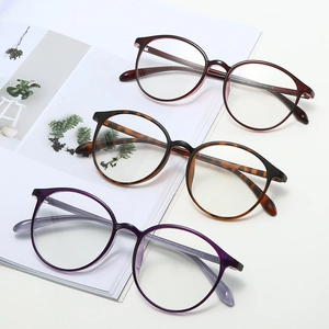 Three pairs of lightweight round eyeglasses in burgundy, tortoiseshell, and transparent purple