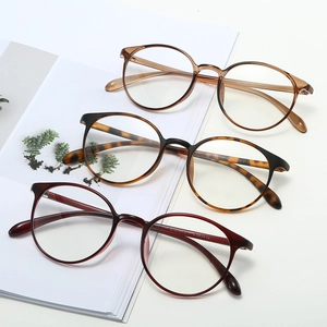 Three pairs of stylish TR90 round frame glasses in assorted retro colors on a white background