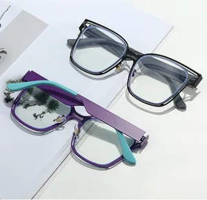 Close-up of square hollow frames with anti-blue light lenses in classic black and mixed colors