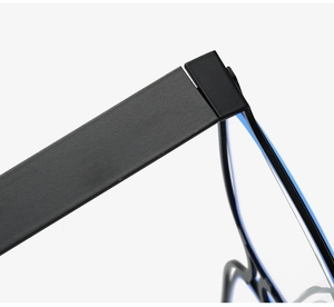 Detail of matte black hollow frame hinges and blue light blocking lens texture