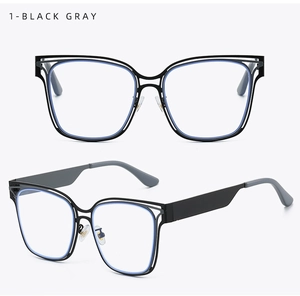 Detail of black and gray hollow square frame blue light glasses with wide temples