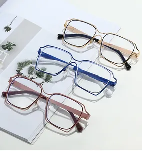 Three pairs of oversized rectangular metal glasses frames in assorted color combinations