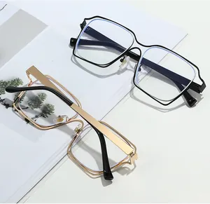 Close-up of oversized square frames with unique double-layer hollowed metal design