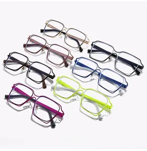 Detailed overhead view of multiple oversized hollow-out rectangle eyeglass frames in various colors