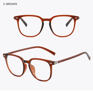 Detail of brown translucent TR90 eyeglass frames with vintage metal rivet decorations