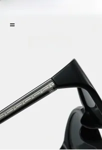 Macro detail of wide black temples with silver wavy metal inserts and elastic hinges