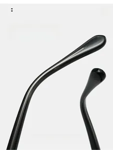 Close-up of sleek black curved temples on cat eye sunglasses for ergonomic comfort