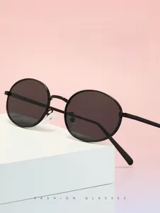 Detail of retro oval cat-eye sunglasses with metal frame and silicone nose pads