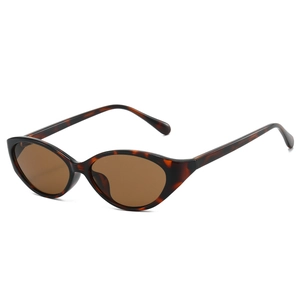 Retro cat-eye sunglasses with tortoiseshell frame and brown lenses in a 45-degree side view