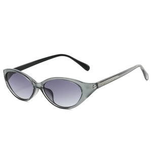 Cat eye oval sunglasses with translucent grey frame and purple gradient lenses