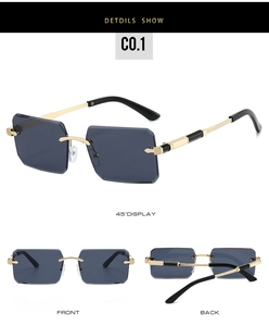 Detail view of rimless square sunglasses with gold metal temples and gradient dark lenses