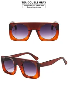 Detail view of large square tea brown frames with purple-grey gradient lenses