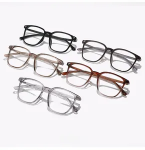 Flat lay of TR8065 square frame glasses in black, amber, and transparent colors