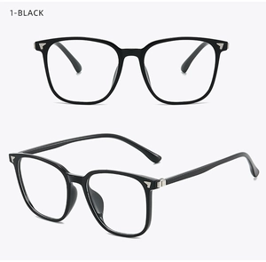 Detail of black square full-frame glasses with silver arrow accents and glossy finish