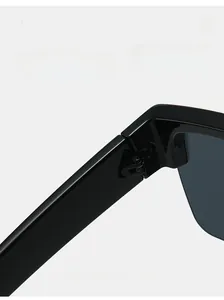 Detail of durable reinforced hinges on oversized square black sunglasses frame