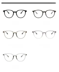 Flat lay of vintage round glasses frames in five colors including black and khaki