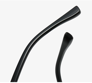 Macro detail of high-gloss black temple arm showing premium polished eyeglass frame craftsmanship