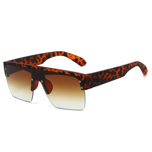 Oversized flat top sunglasses with leopard print frames and brown gradient lenses