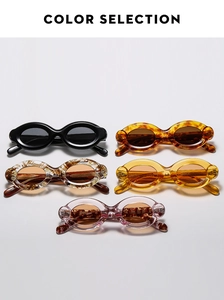 Five assorted vintage thick-frame oval sunglasses in diverse colors on a white background