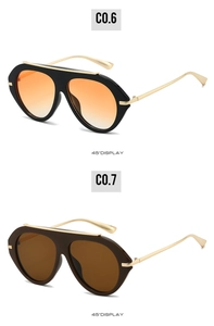 Detail view of retro oversized aviator sunglasses in orange gradient and brown tints