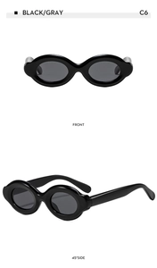 Front and side view of thick oval sunglasses with glossy black frames and gray lenses