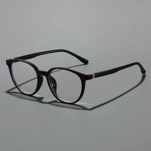 Classic round black frame glasses with subtle gold metal accents on sleek temples