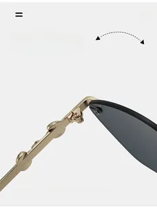 Macro view of durable golden metal hinge on frameless cat-eye sunglasses for women