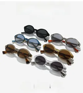 Flat lay of retro oval sunglasses in multiple colors including black and green