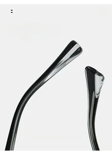 Detail view of glossy black curved temples for comfortable wear on oval sunglasses