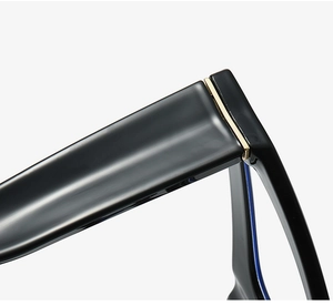 Close-up of golden metal hinge detail on luxury black cat-eye eyeglass frames
