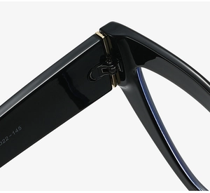 Macro shot of durable hinges and glossy black frame detail on cat-eye glasses