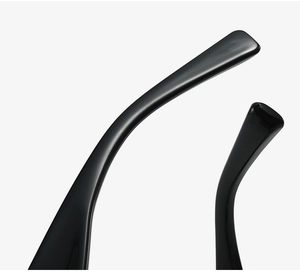 Detailed macro shot of glossy black temple tips on fashion cat-eye glasses frames