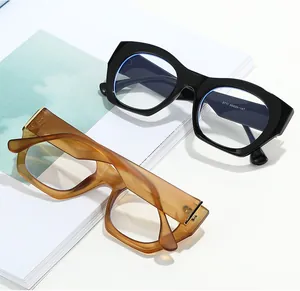 Close-up of black and amber oversized cat eye glasses frames with blue light coating