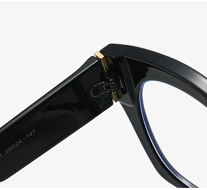 Macro detail of high-quality metal hinge and size specifications on cat-eye glasses frame