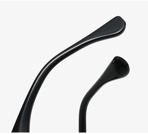 Detail of glossy black eyewear temple with sleek curved design and smooth finish