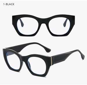 Detail of vintage black cat-eye glasses frame with metal hinges and blue light lenses