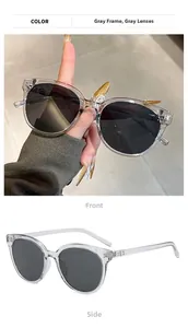Detailed front and side views of vintage round oversized gray sunglasses for men and women